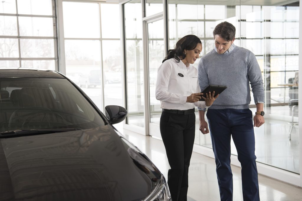 A salesperson going over the Buick Warranty options in Akron, OH