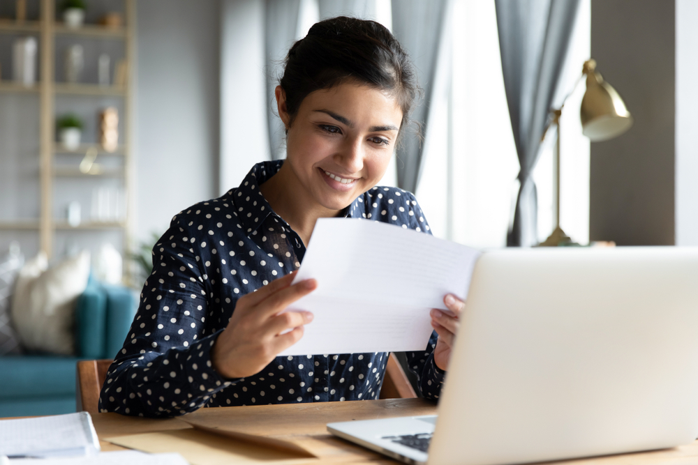 A woman reviewing tax paperwork.